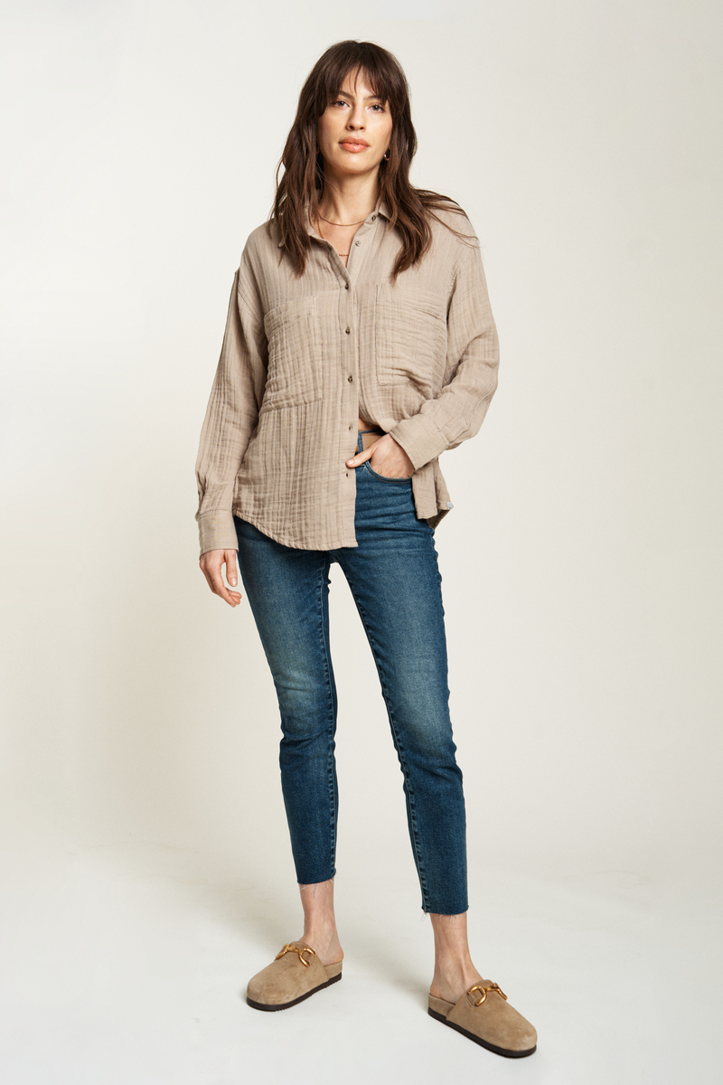 Beige button-up top in a soft, lightweight fabric, styled with blue jeans for a relaxed, everyday look