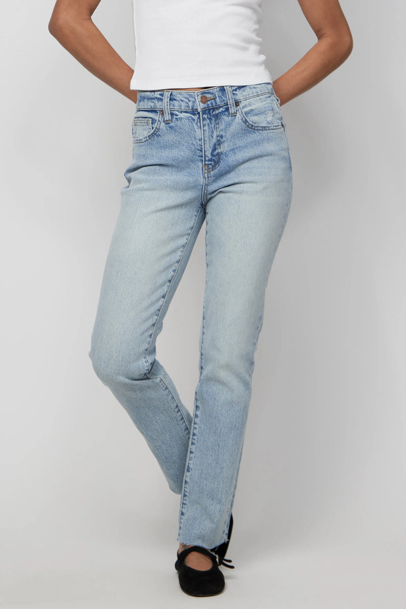Close-up of high-rise light wash relaxed jeans with clean front and natural fade detail.