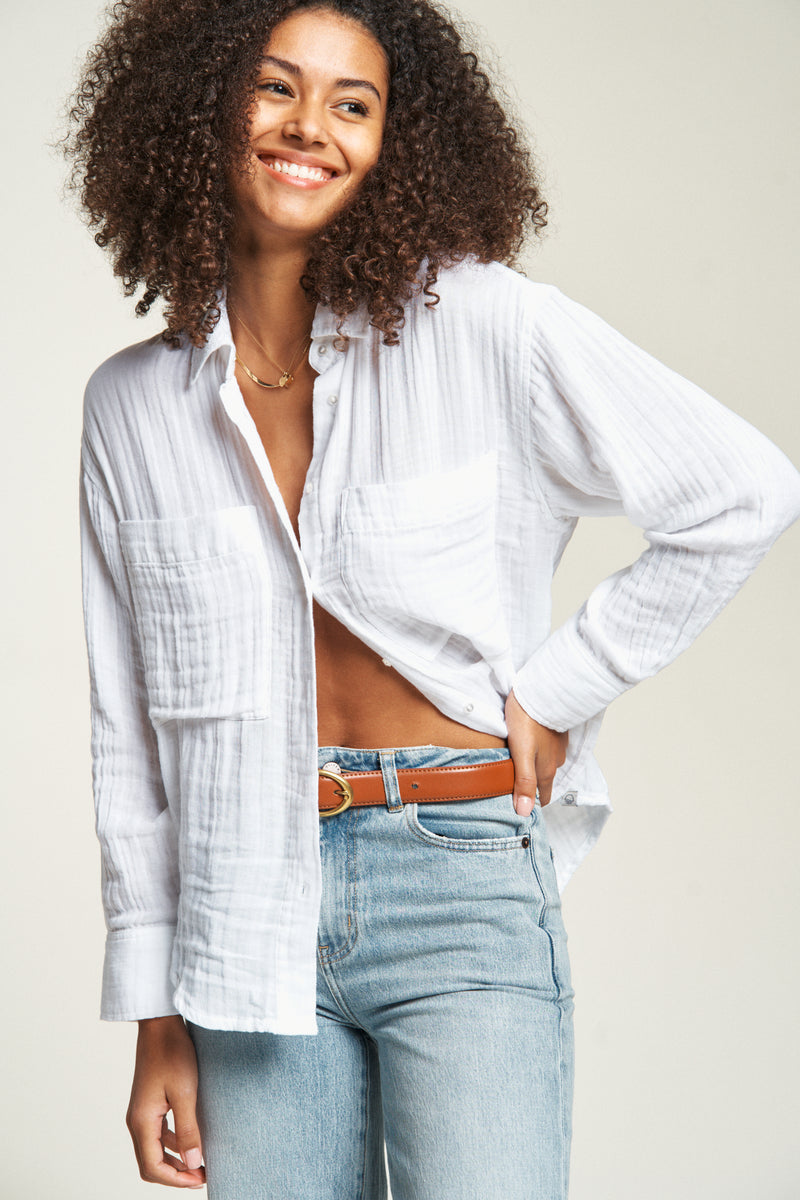 Classic long-sleeve button-up top for women, crafted from lightweight fabric for a comfortable yet polished outfit.
