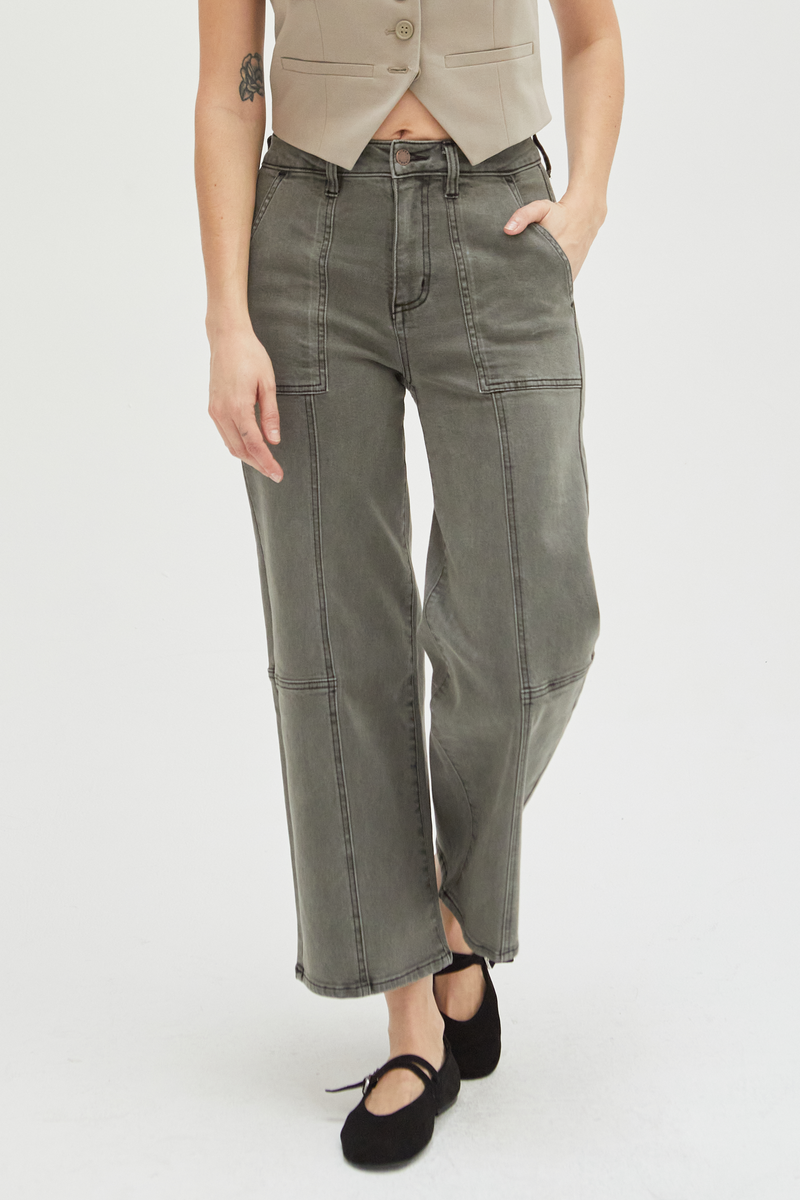 Close-up of olive wide-leg ankle crop jeans, emphasizing the durable denim construction and unique stitching details.