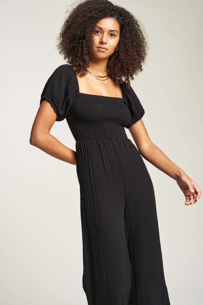 Soft cotton black jumper with a relaxed fit and puff sleeves, designed for effortless style and all-day comfort.
