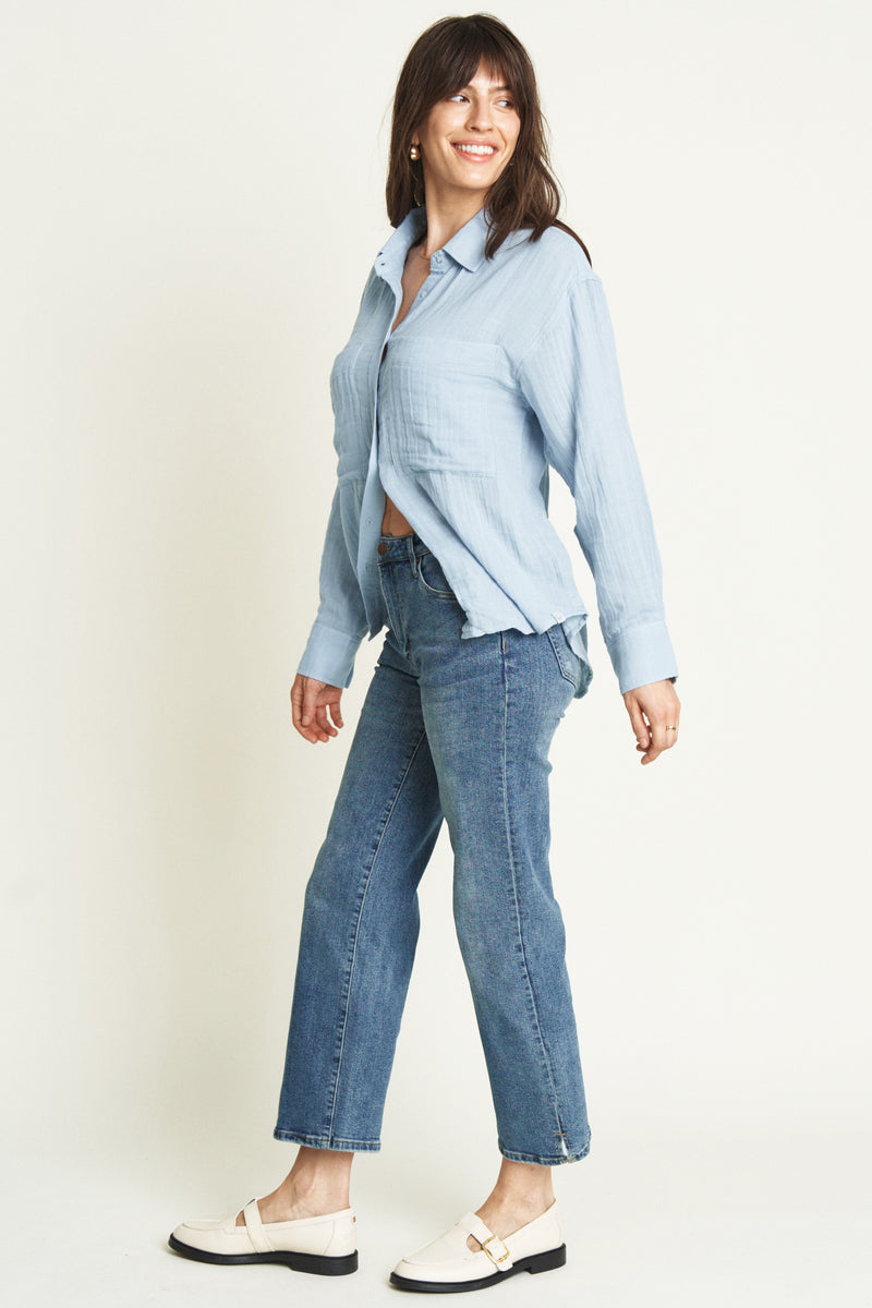 Front view of the model in wide leg crop jeans. The high-rise waist and cropped length offer a stylish, versatile look with a structured fit.