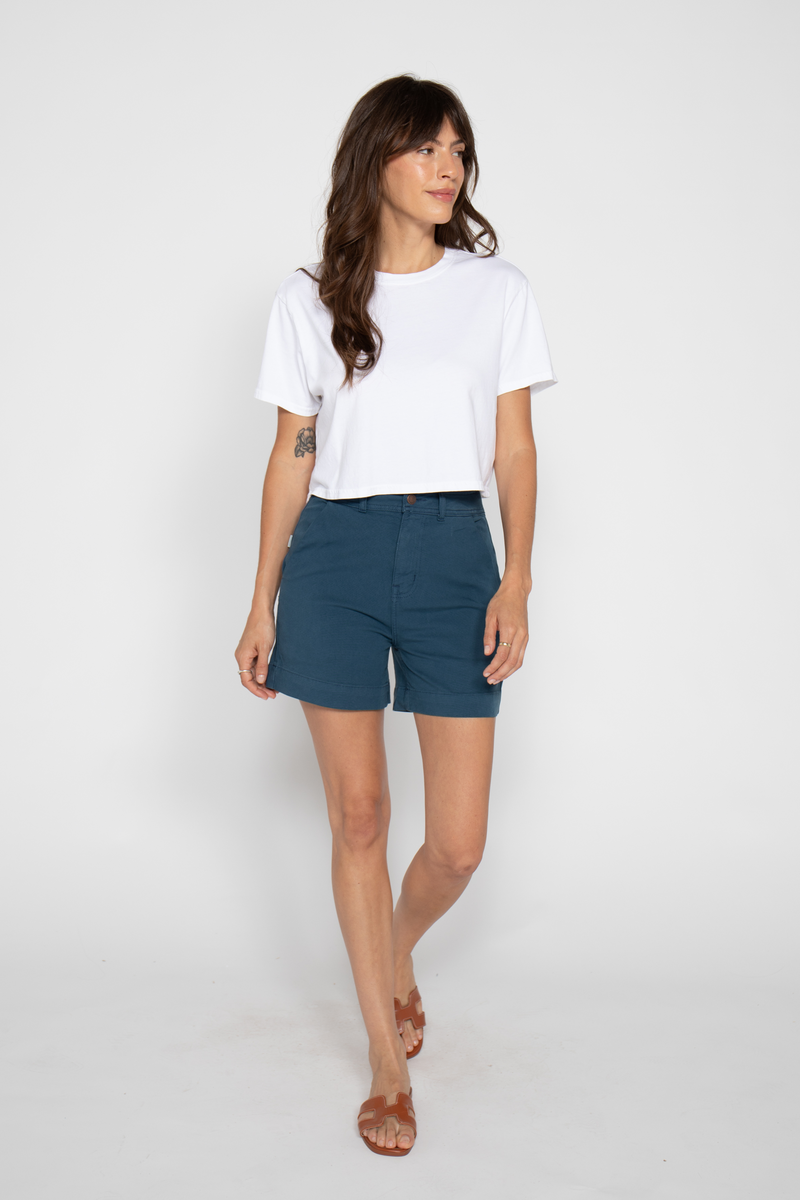 Lightweight blue shorts made with 100% cotton, featuring a high-rise fit, perfect for warm summer days with a breathable design.