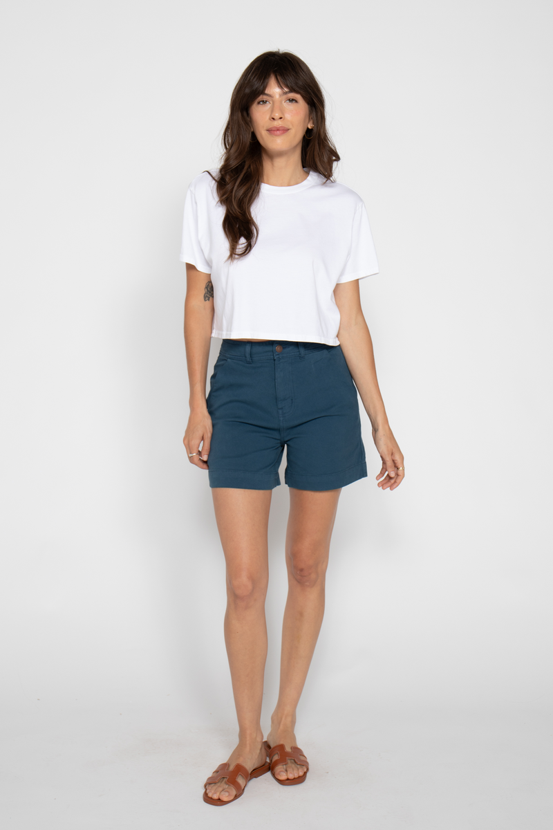 High-rise blue shorts made from breathable 100% cotton, providing a lightweight summer style for warm-weather activities.