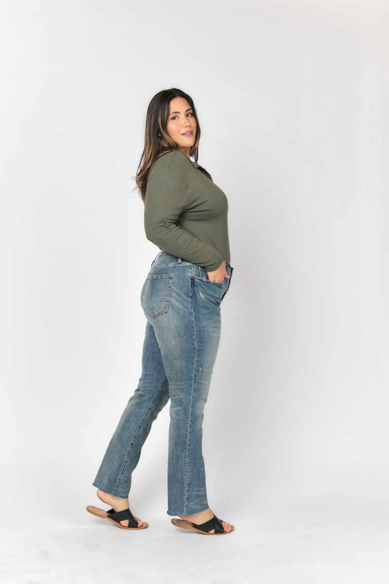 Side profile of model in high rise straight jeans, showcasing the durable denim and comfortable, vintage-inspired style.