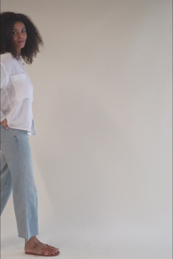 Casual long-sleeve button-up top with a relaxed fit and lightweight fabric, perfect for an easy, everyday look.