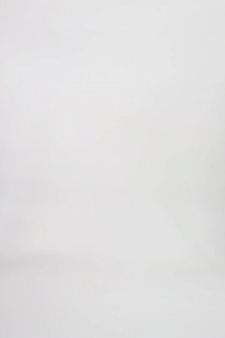 Video of model walking forward in sustainable wide-leg denim with cargo pockets, showcasing light washed jeans in motion.