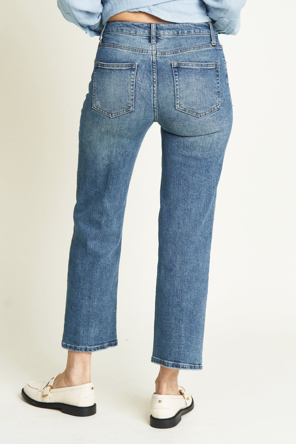 Close-up view of the high-rise wide leg crop jeans for women. The cropped hem adds a modern touch to these vintage-inspired jeans.