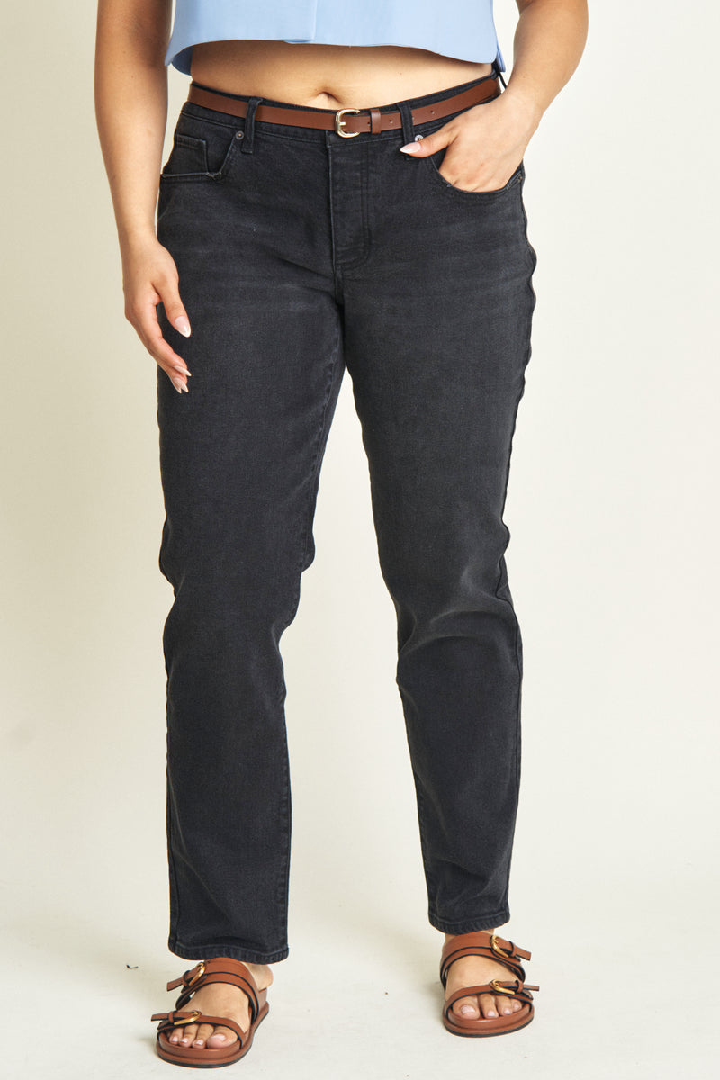 Close-up of black low-rise jeans, highlighting the durable denim material and subtle faded detailing.