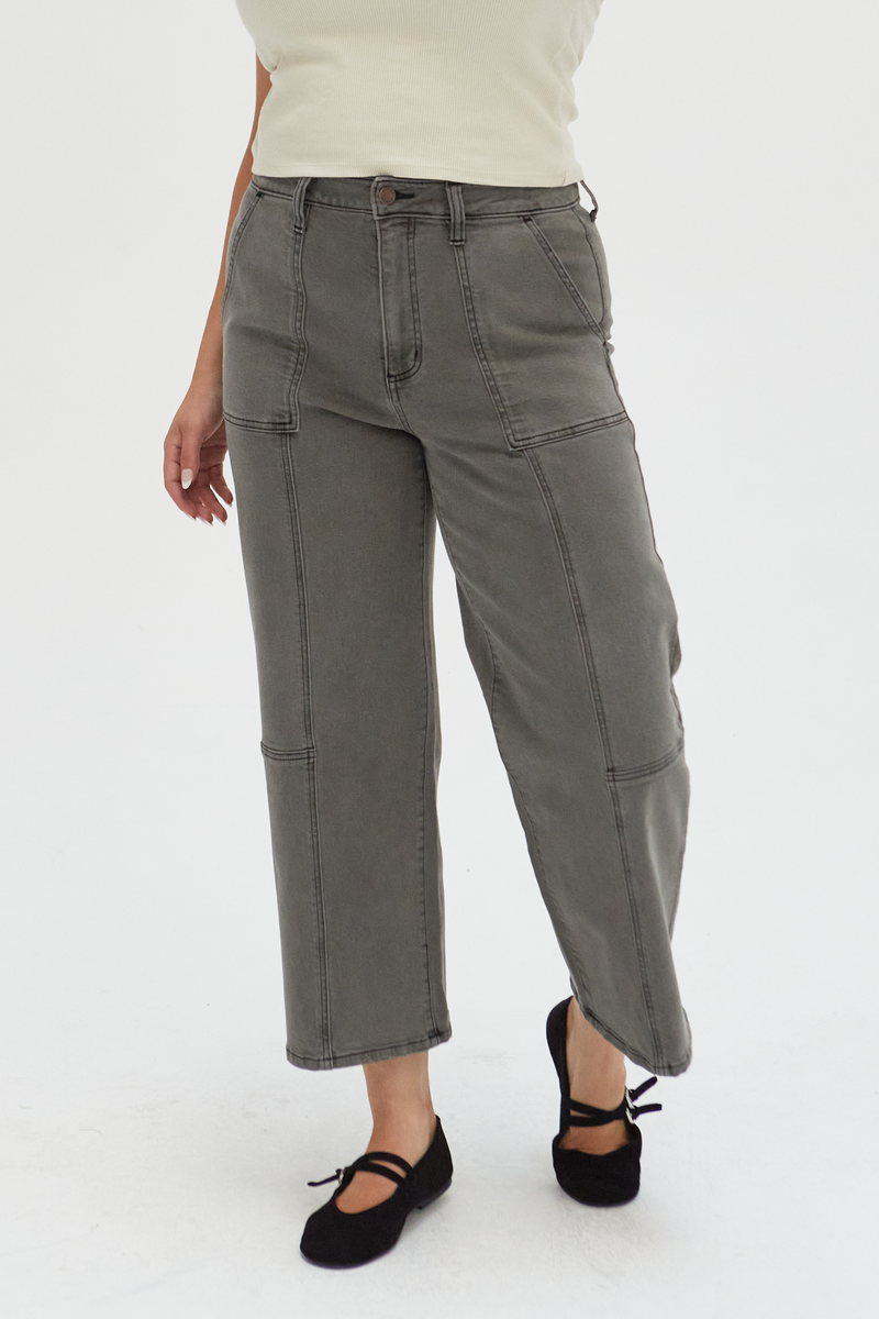 Close-up of olive wide-leg ankle crop jeans, emphasizing the structured silhouette and sustainable denim construction.