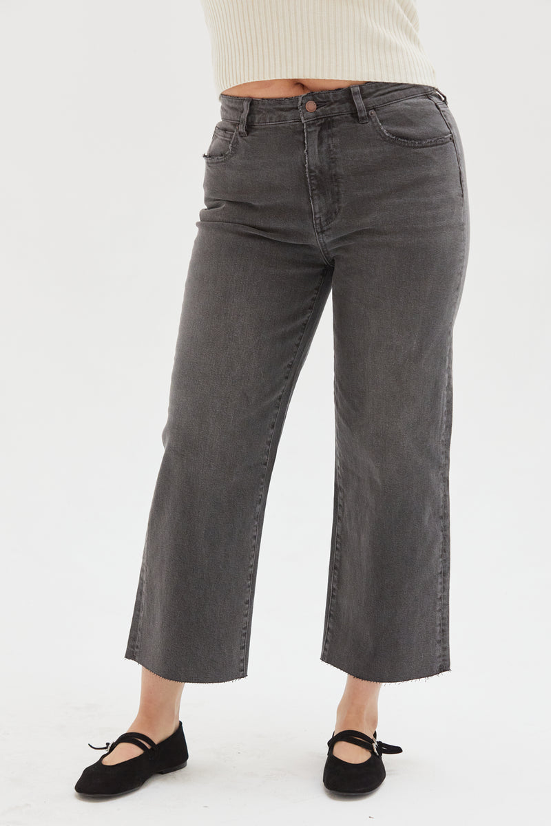 Close-up of the gray cropped wide-leg jeans, emphasizing durable denim and stylish wide-leg cut.
